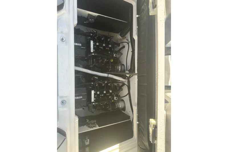 Slide: The Image of 2025 Yamaha Boats AR220 engine compartment showcasing dual Yamaha engines. - 10