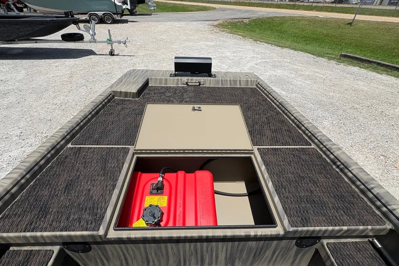 Slide: The Image of 2027 Gator Tail 1860 boat with open storage compartment and red fuel tank. - 13