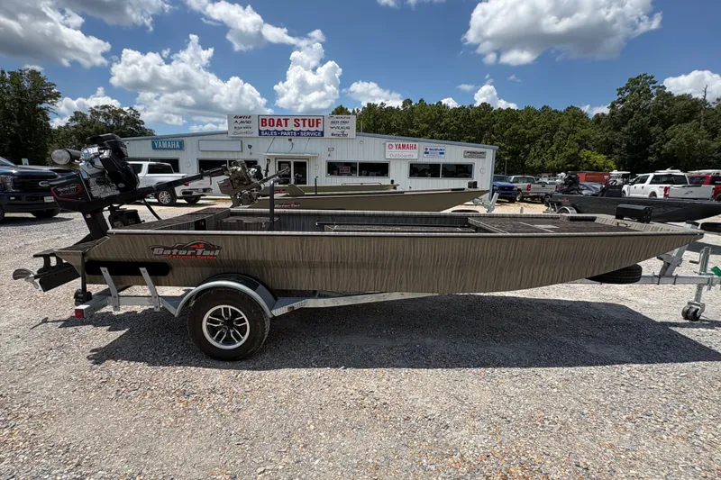 The Image of 2027 Gator Tail 1860 boat on trailer at dealership, sunny day. - 0