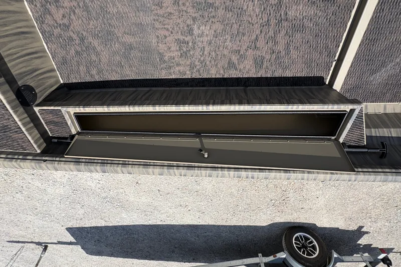 Slide: The Image of Open storage compartment on a 2027 Gator Tail 1860 boat, viewed from above. - 10