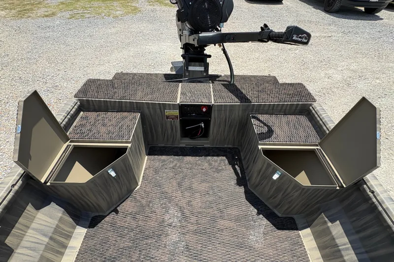 Slide: The Image of 2027 Gator Tail 1860 boat interior with open storage compartments and motor controls. - 9