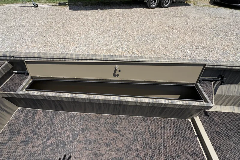 Slide: The Image of Open storage compartment in 2027 Gator Tail 1860 boat, showcasing interior space and design. - 11