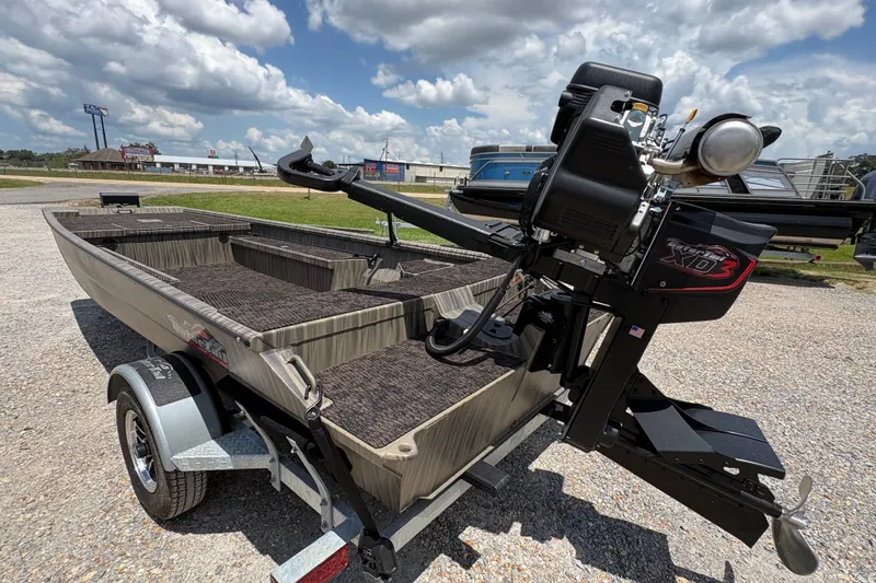 Slide: The Image of 2027 Gator Tail 1860 boat with XD3 motor on a trailer, under a cloudy sky. - 8