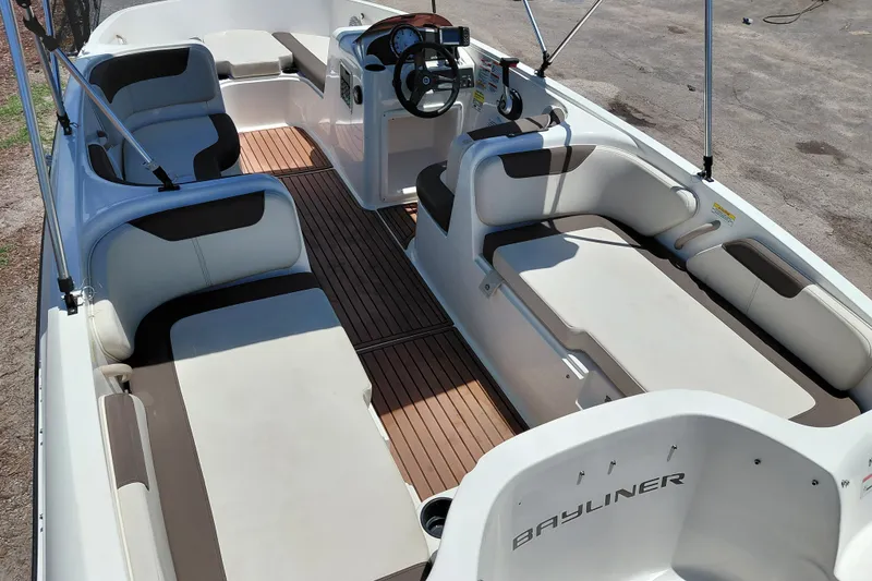 Slide: The Image of 2022 Bayliner Element E18 boat interior with spacious seating and modern design. - 28