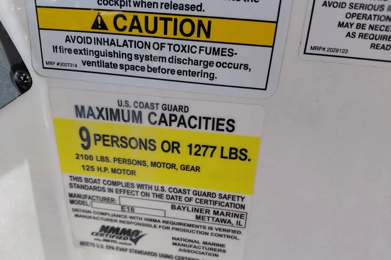 Slide: The Image of 2022 Bayliner Element E18 capacity label, maximum 9 persons or 1277 lbs, 125 HP motor. - 19