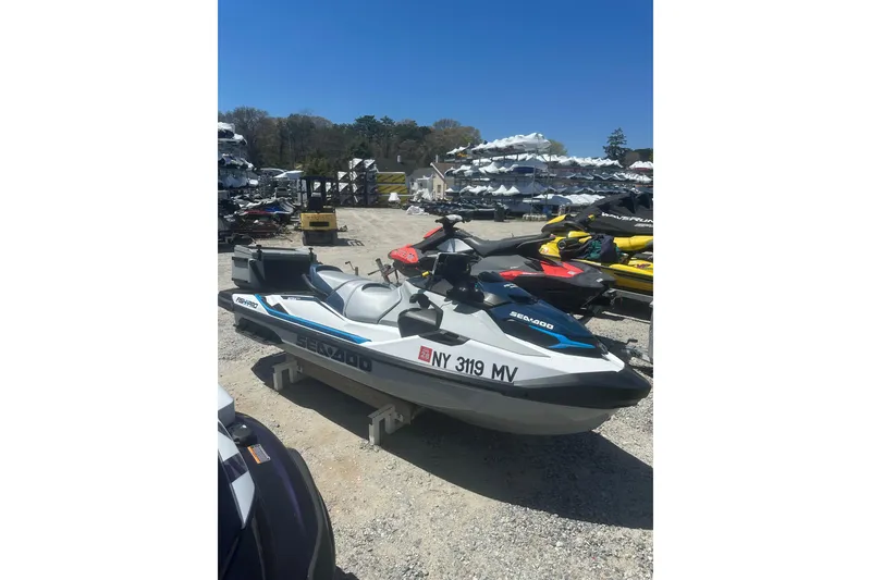 Slide: The Image of 2024 Sea-Doo FishPro Sport 170 jet ski displayed outdoors on a sunny day. - 6