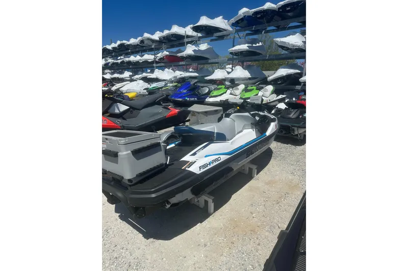 Slide: The Image of 2024 Sea-Doo FishPro Sport 170 jet ski displayed in outdoor showroom. - 8