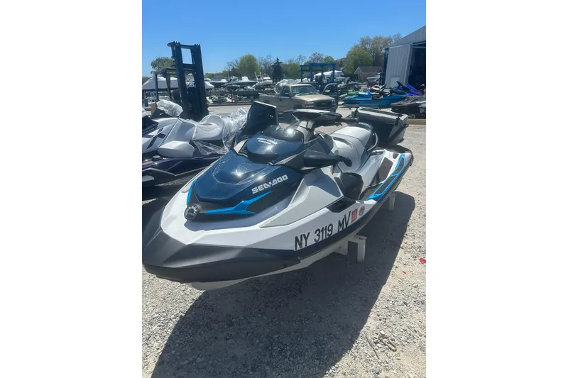 Slide: The Image of 2024 Sea-Doo FishPro Sport 170 jet ski parked outdoors on gravel. - 4