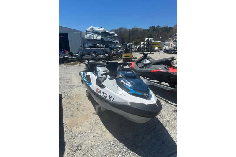 Slide: The Image of 2024 Sea-Doo FishPro Sport 170 jet ski parked outdoors on gravel lot. - 7