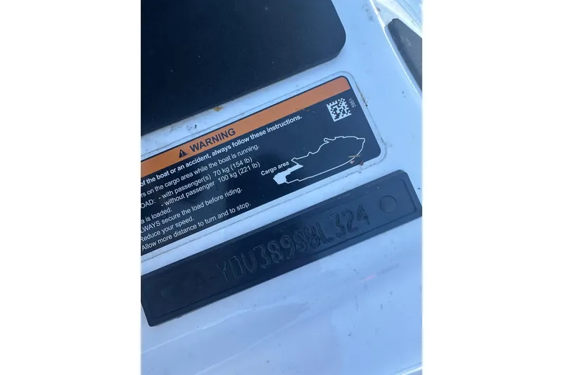 Slide: The Image of 2024 Sea-Doo FishPro Sport 170 warning label and serial number plate. - 12
