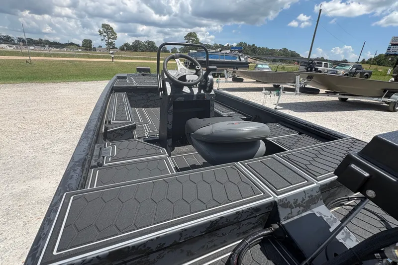 Slide: The Image of 2027 Gator Tail 1860 CC Extreme boat with sleek black interior and steering console. - 11