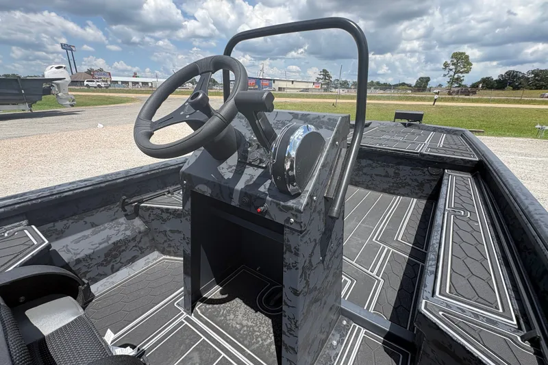 Slide: The Image of 2027 Gator Tail 1860 CC Extreme boat interior with steering console under cloudy sky. - 10