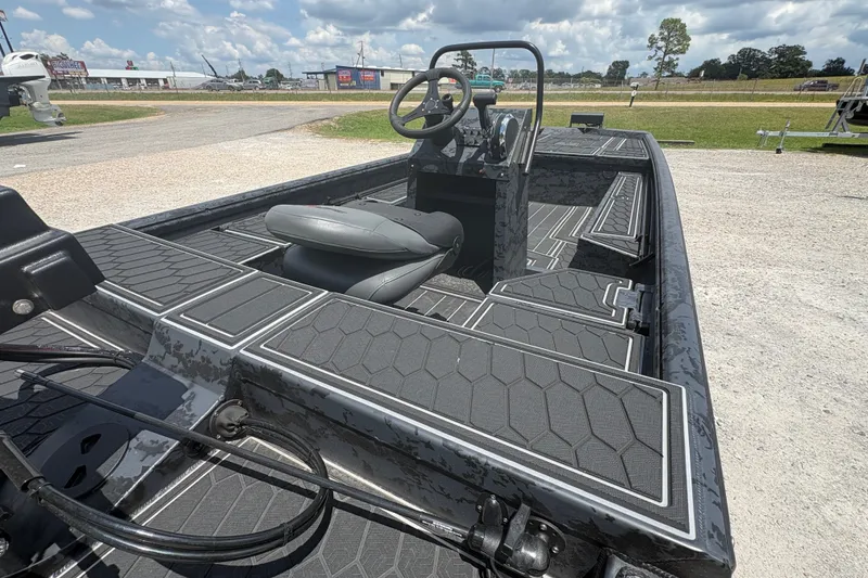 Slide: The Image of 2027 Gator Tail 1860 CC Extreme boat with sleek interior design and modern steering console. - 9