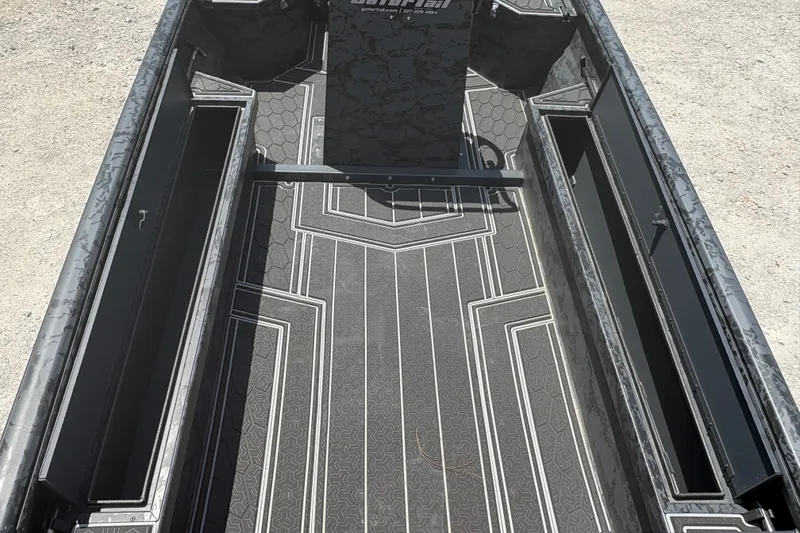 Slide: The Image of 2027 Gator Tail 1860 CC Extreme boat interior with sleek, patterned flooring design. - 16