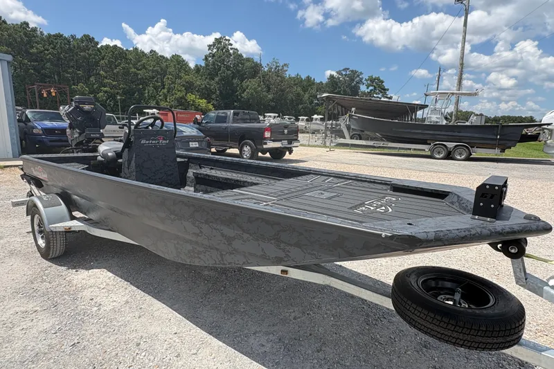 Slide: The Image of 2027 Gator Tail 1860 CC Extreme boat on trailer, parked outdoors under a sunny sky. - 4