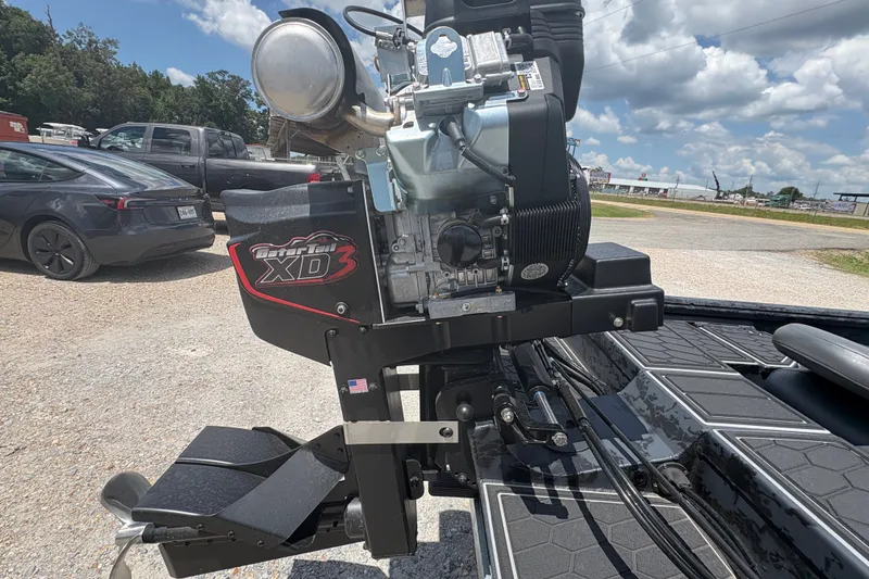 Slide: The Image of 2027 Gator Tail 1860 CC Extreme boat engine, Gator Tail XD3, in a parking lot. - 6