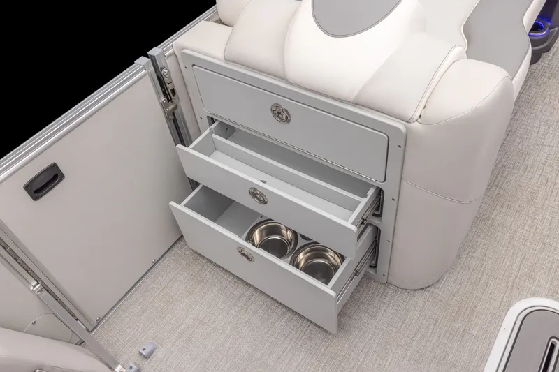 Slide: The Image of Interior of a boat with two open drawers containing metal bowls. - 14