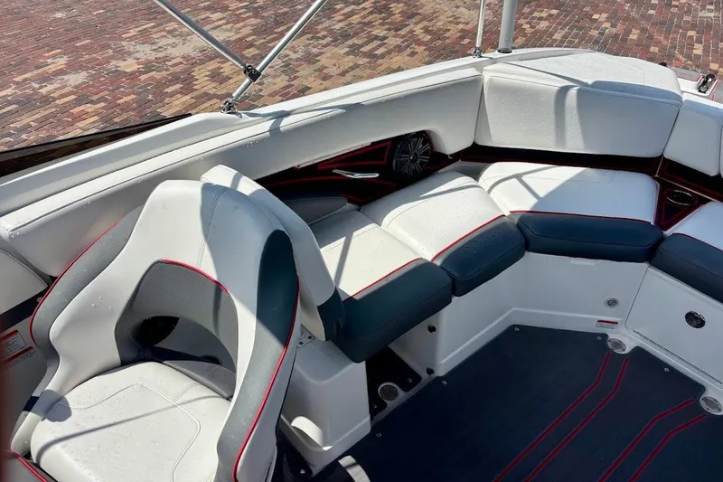 Slide: The Image of Interior of 2023 Tahoe 210 S Limited boat with white and gray seating. - 17