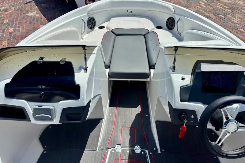 Slide: The Image of 2023 Tahoe 210 S Limited boat interior with modern dashboard and seating. - 15