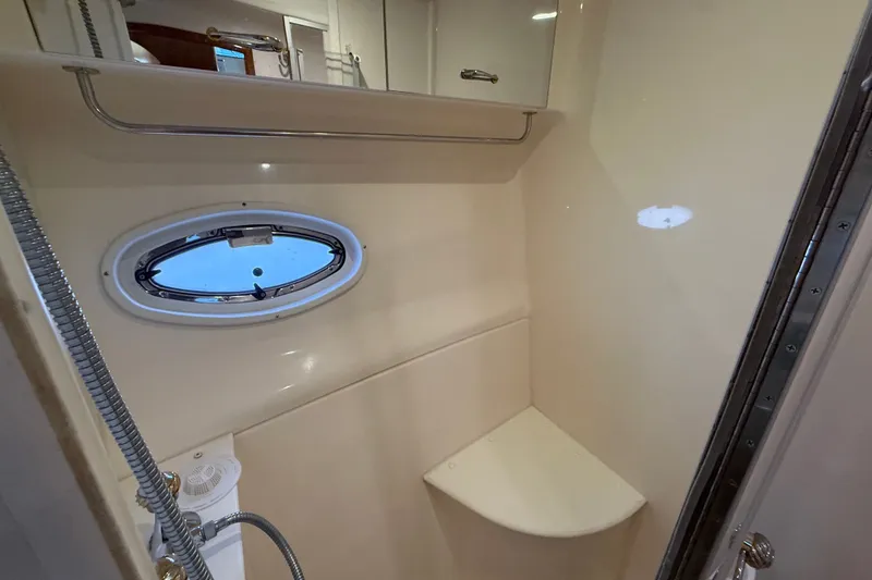 Slide: The Image of Bathroom interior of 2003 Carver 466 Motor Yacht with porthole and shower. - 49