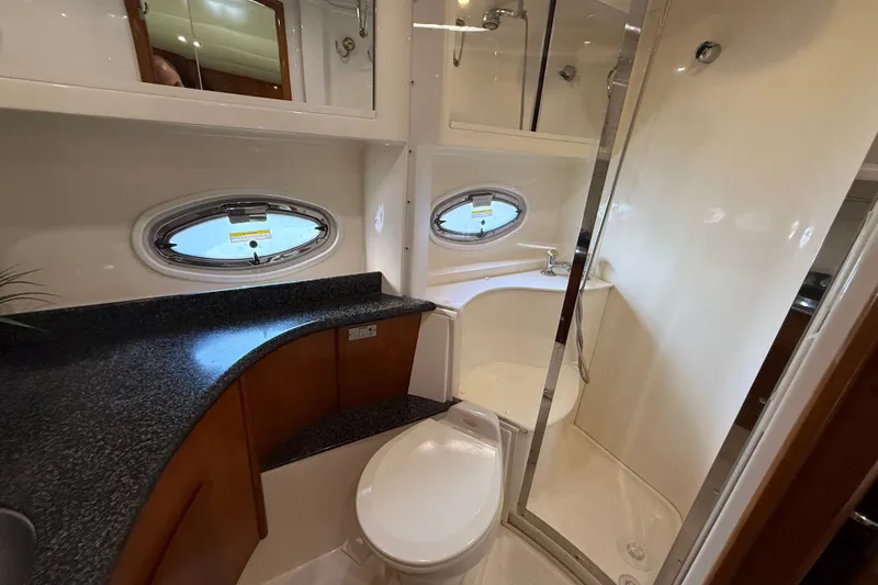 Slide: The Image of Luxurious bathroom in 2003 Carver 466 Motor Yacht with shower and porthole windows. - 37