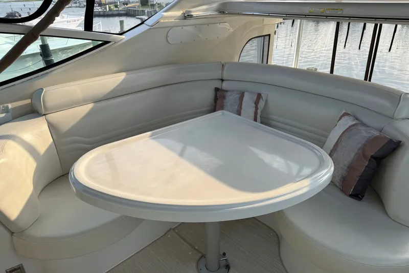 Slide: The Image of Luxurious seating area on a 2003 Carver 466 Motor Yacht with elegant cushions. - 13