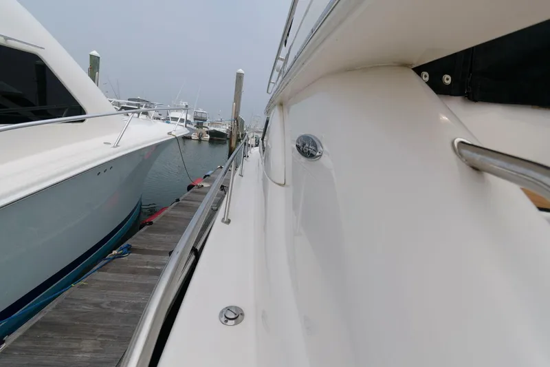 Slide: The Image of 2001 Sea Ray 450 Express Bridge docked at a marina. - 13