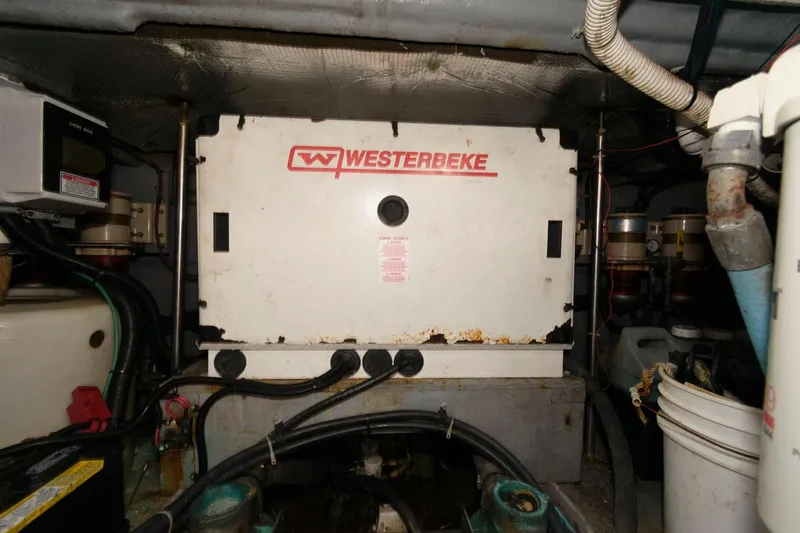 Slide: The Image of Engine room of a 2001 Sea Ray 450 Express Bridge with Westerbeke generator. - 27