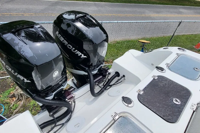 Slide: The Image of 2023 Wellcraft 302 Fisherman boat with dual Mercury outboard engines. - 18