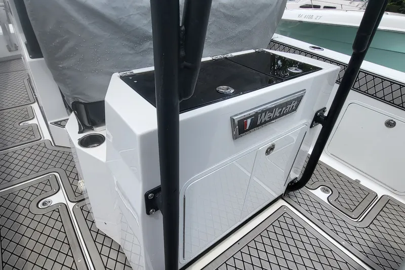 Slide: The Image of 2023 Wellcraft 302 Fisherman boat interior with sleek design and storage compartments. - 8