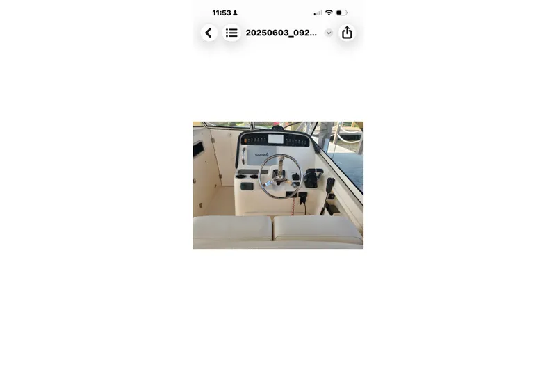 Slide: The Image of 2017 Grady-White Freedom 307 boat helm with steering wheel and controls. - 28