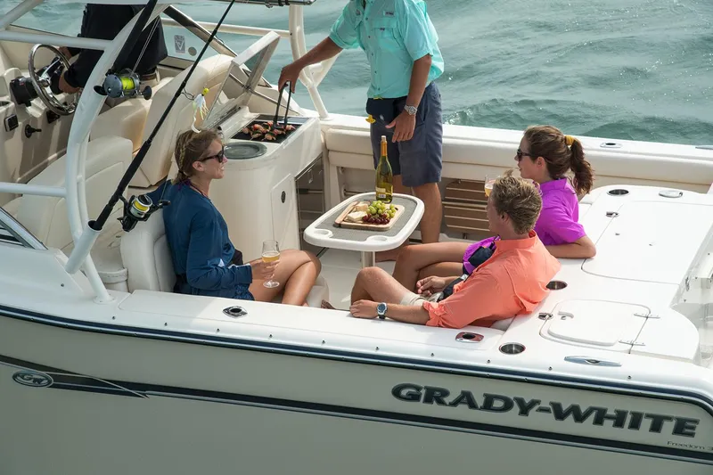 Slide: The Image of Manufacturer Provided Image: 2017 Grady-White Freedom 307 boat with people enjoying a meal on deck. - 6