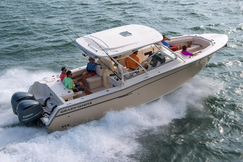 Slide: The Image of Manufacturer Provided Image: 2017 Grady-White Freedom 307 boat cruising on the water with passengers. - 4