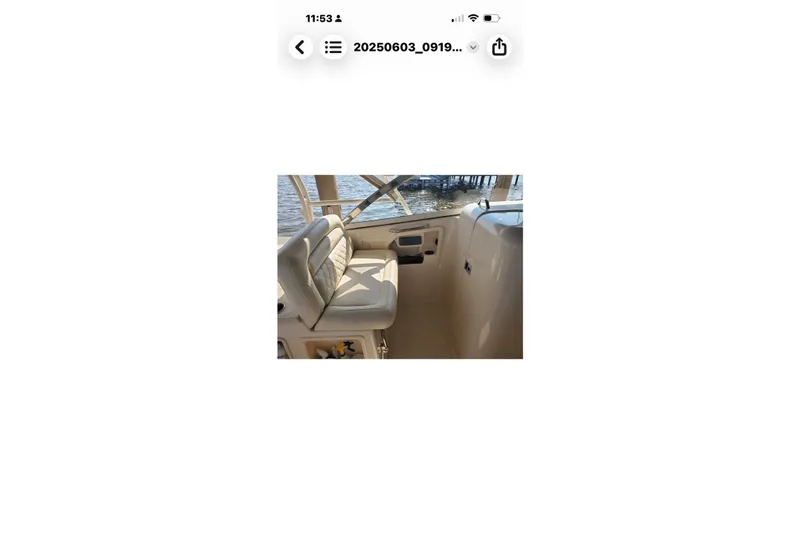 Slide: The Image of 2017 Grady-White Freedom 307 boat interior with cushioned seating by the water. - 31