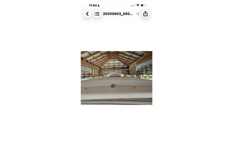 Slide: The Image of 2017 Grady-White Freedom 307 boat in a wooden boathouse. - 18