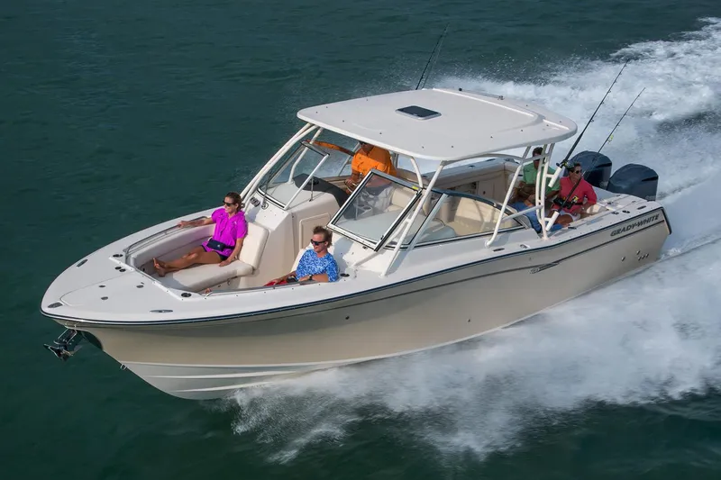 Slide: The Image of Manufacturer Provided Image: 2017 Grady-White Freedom 307 boat cruising on water with passengers. - 3