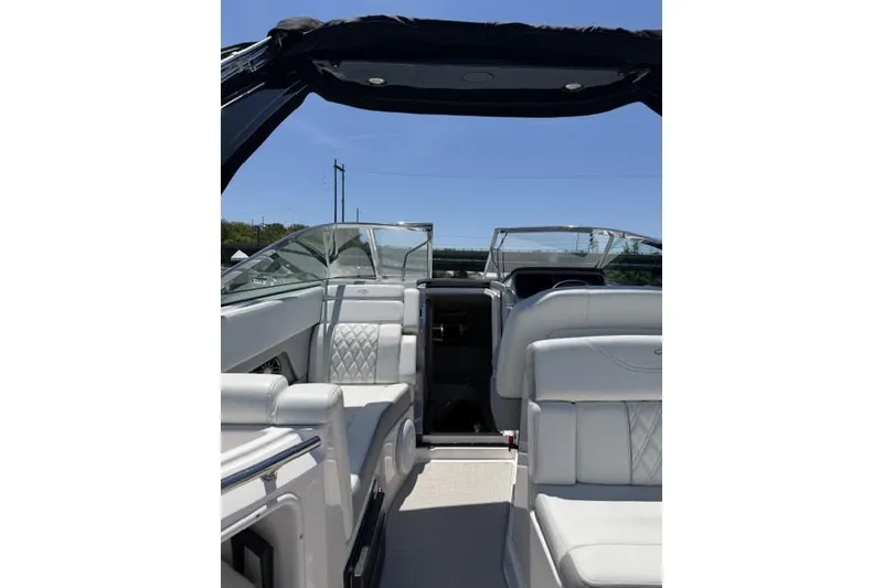 Slide: The Image of 2024 Regal 28 Express boat interior with white seating and open cockpit. - 3