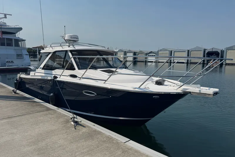 The Image of 2027 Cutwater C-248 Coupe docked at marina, showcasing sleek design and modern features. - 0