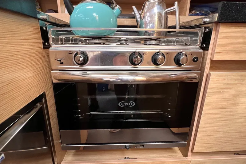 Slide: The Image of Stainless steel stove and oven in a 2020 Hanse 458 yacht kitchen. - 45