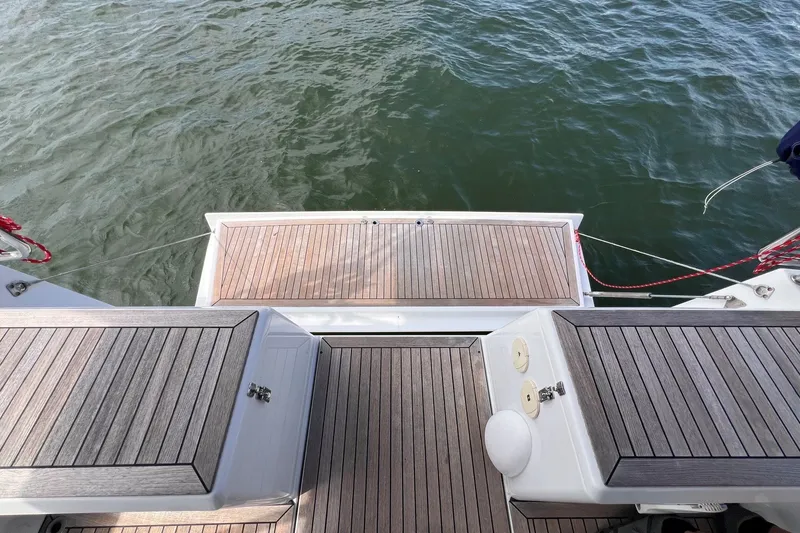 Slide: The Image of Teak deck of 2020 Hanse 458 yacht with water view. - 35