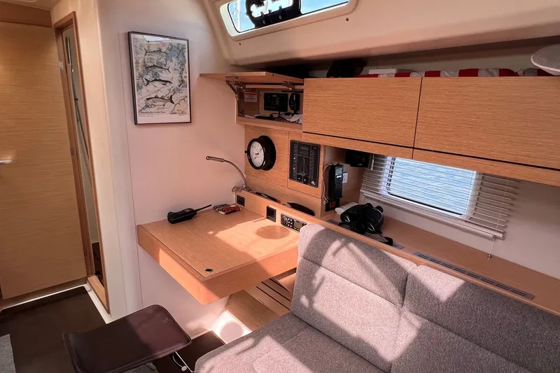 Slide: The Image of Interior of 2020 Hanse 458 yacht with navigation station and modern wood finish. - 47