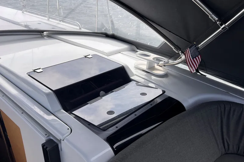 Slide: The Image of 2020 Hanse 458 yacht deck with American flag and cup holders. - 38