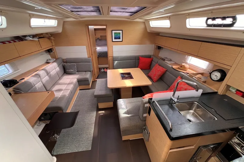 Slide: The Image of Modern interior of 2020 Hanse 458 yacht with cozy seating and kitchen area. - 39