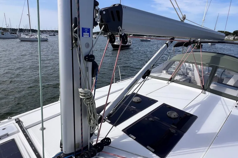 Slide: The Image of 2020 Hanse 458 sailboat deck with rigging and marina view. - 15