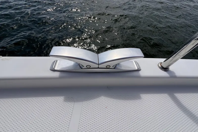 Slide: The Image of Sleek cleat on 2020 Hanse 458 yacht deck by the water. - 31