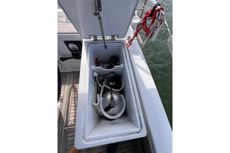 Slide: The Image of Open storage compartment on 2020 Hanse 458 yacht, containing ropes and equipment. - 27