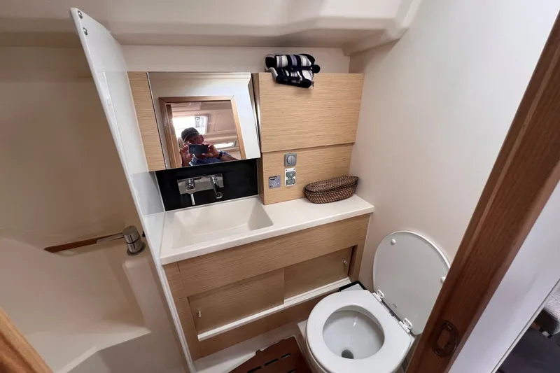 Slide: The Image of Modern bathroom interior on a 2020 Hanse 458 yacht, featuring a sink and toilet. - 64