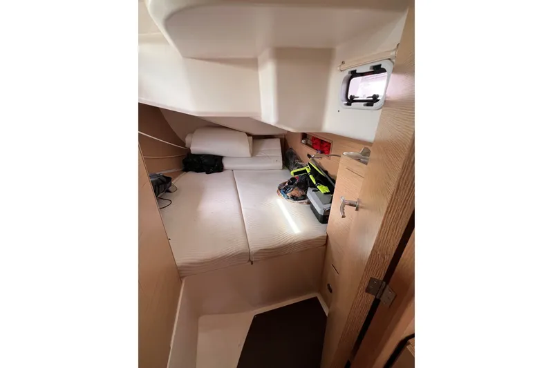 Slide: The Image of Cozy cabin interior of 2020 Hanse 458 yacht with bed and storage. - 60