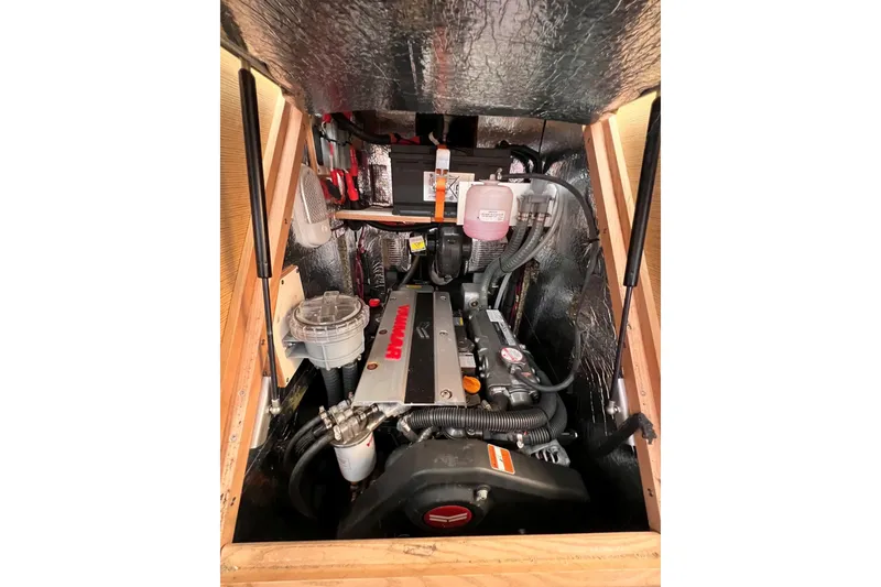 Slide: The Image of Engine compartment of a 2020 Hanse 458 yacht, featuring a Yanmar engine. - 67