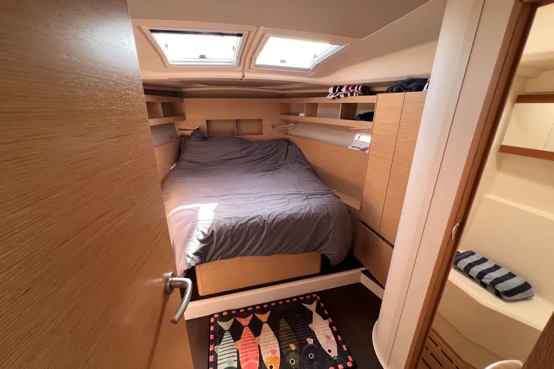 Slide: The Image of Cozy cabin interior of 2020 Hanse 458 yacht with bed and storage. - 55